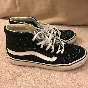 Black and white high top vans